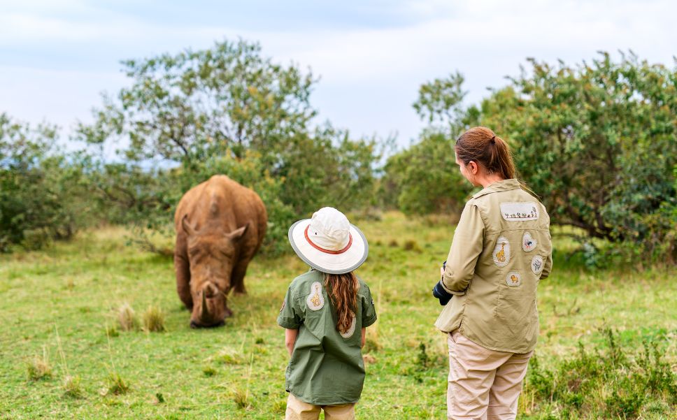 Mother and daughter visit a rhino conservation project.