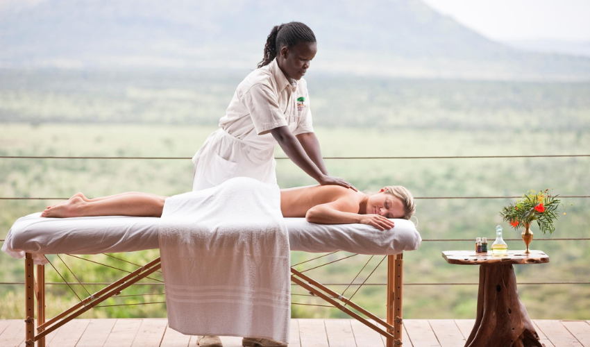 A guest enjoys a relaxing massage at Cottars Safari Camp.